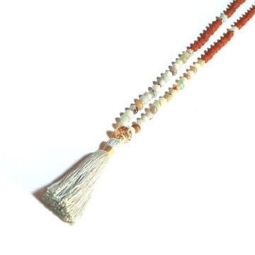 Close up of handmade Arogitā Mala Necklace – Health, Happiness & Emotional Balance with gold filigree guru bead